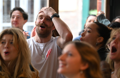 Football fans reacting to key moment in derby football match.JPG